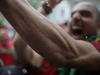 A Portugal soccer fan gets goosebumps as he celebrate Portugal's goal over France in the UEFA Euro 2016 final as he watches at Bayou Bar on  St. Laurent boulevard in Montreal on Sunday, July 10, 2016.