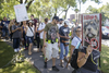 People take part in a protest against breed-specific legislation for dogs at Pelican Park in Montreal on Saturday, July 16, 2016. The demonstration was against the recent proposed bans on pit bull dogs in Quebec after a series of high profile attacks.