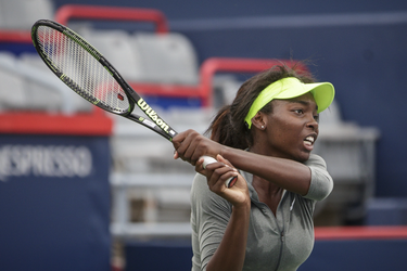 Canadian tennis player Françoise Abanda hits a return during a practice session ahead of the Rogers Cup Tennis Tournament at Uniprix Stadium in Montreal on Friday, July 22, 2016.