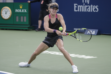 Canadian tennis player Eugenie Bouchard hits a return during a practice session ahead of the Rogers Cup Tennis Tournament at Uniprix Stadium in Montreal on Friday, July 22, 2016.