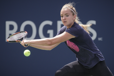 Sixteen year-old Canadian tennis player Charlotte Robillard-Millette hits a return during a practice session ahead of the Rogers Cup Tennis Tournament at Uniprix Stadium in Montreal on Friday, July 22, 2016.