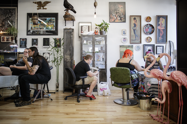 Pokemon fans get tattoos of Pokemon characters as part of a Pokemon Go promotion day at DFA Tattoos in Montreal on Sunday, July 24, 2016.