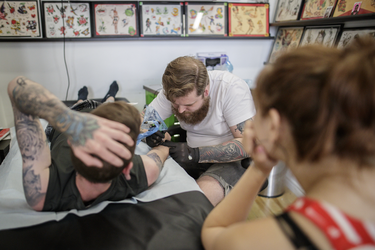Pokemon fan Colin Lavigne gets a tattoo of the character Cubone from tattoo artist Angus Byers as part of a PokemonGo promotion day at DFA Tattoos in Montreal on Sunday, July 24, 2016.