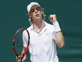 Canada's Denis Shapovalov celebrates after winning a point against Hungary's Mate Valkusz during boys' singles match at Wimbledon on July 7, 2016.
