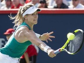 Westmount's Eugenie Bouchard hits a backhand return to the Czech Republic's Lucie Safarova during first round Rogers Cup action Tuesday July 26, 2016, in Montreal.