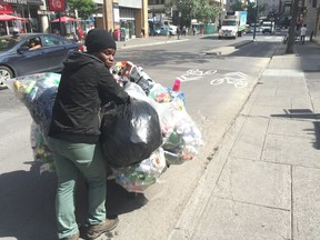 Evens has been collecting cans and living on the streets of Montreal since 2009. He earns between $20 and $40 a day. Photo by Rene Bruemmer