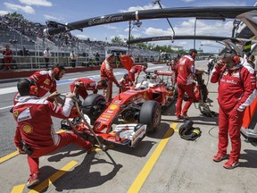 Ferrari Formula One driver Sebastian Vettel makes a pit stop during the second practice session for the Formula One Canadian Grand Prix at the Circuit Gilles-Villeneuve in June.