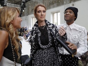 Céline Dion, with stylist Law Roach, right, at Giambattista Valli's 2016-2017 fall/winter Haute Couture collection fashion show on July 4, 2016 in Paris.