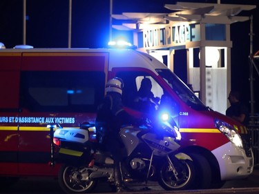 Police officers and firefighters arrive near the site of an attack on July 14, 2016, after a van ploughed into a crowd leaving a fireworks display in the French Riviera town of Nice. Up to 30 people are feared dead and over 100 others were injured after a van drove into a crowd watching Bastille Day fireworks in the French resort of Nice on July 14, a local official told French television, describing it as a "major criminal attack".
