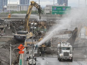 Construction crews demolish the St-Jacques St. overpass over the Décarie Expressway in Montreal on Saturday, July 9, 2016.