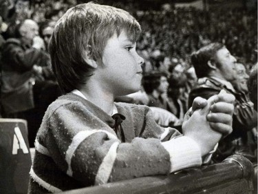 March 1976: A young spectator takes in a Canadiens game at the Montreal Forum.