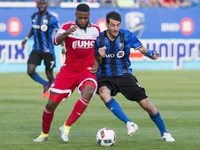 Montreal Impact's Ignacio Piatti, right, battling New England Revolution's Andrew Farrell on July 2,  will face the Philadelphia Union on Saturday at Saputo Stadium after serving a one-game suspension.