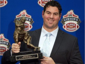 Josh Bourke, pictured with his award for the CFL's outstanding lineman in 2011, will play his first game against his former team Monday night.