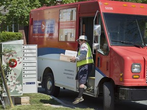 A Canada Post employee at work.