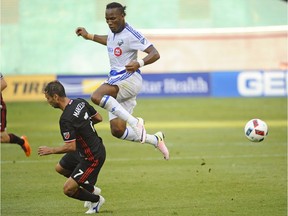 Montreal Impact forward Didier Drogba (11) battles D.C. United midfielder Marcelo Sarvas (7) for the ball during the first half at Robert F. Kennedy Memorial on Sunday, July 31, 2016.