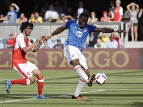 MLS All-Stars' Didier Drogba, right, of the Montreal Impact, scores next to Arsenal's Mohamed Elneny during the first half of the MLS All-Star soccer game Thursday, July 28, 2016, in San Jose, Calif.