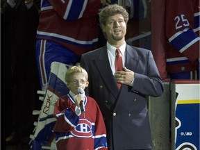 Jérémy Gabriel, a deaf 8-year-old boy who suffers from Treacher-Collins syndrome (which has made his face disfigured) sings O Canada before Canadiens game against New York Islanders at the Bell Centre in Montreal in 2005. Beside him is Charles Prévost-Linton, who had sung the U.S. anthem.