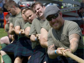 In this Aug. 4, 2014 file photo, members of the Black Watch take part in a tug-of-war event at the Highland Games in Verdun.