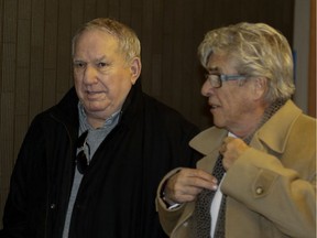 Bernard Trepanier, left,  leaves the Montreal Courthouse with lawyer Pierre Morneau in Montreal on Tuesday Feb. 23, 2016.