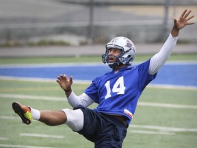 Kicker Boris Bede follows through on a punt during Montreal Alouettes practice at Stade Hebert in Montreal Wednesday July 08, 2015.