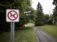 A sign restricts dog-walking at Claude-Robillard Park in Ste. Anne de Bellevue in July 2016.