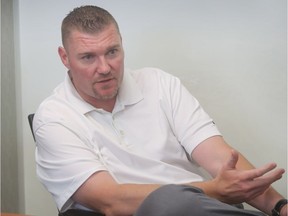 Former Alouettes offensive-lineman Paul Lambert photographed during an interview at Des Sources Chrysler Jeep dealer on July 12, 2016. He now works in auto sales business.