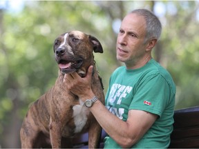 Jack Morantz, with his dog Spartacus in Somerled Park in Montreal Friday, July 15, 2016. Morantz feels sometimes people draw conclusions about him because of his ownership of two pit bulls.