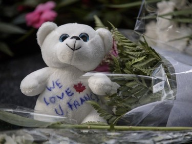 A teddy bear with the words "We Love You France" left at a memorial in memory of the victims of Thursday's terror attack in Nice, France, outside the French consulate in Montreal on Saturday, July 16, 2016.