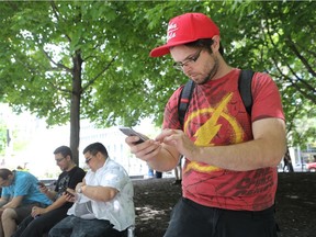 Pokemon Go player Hugo Paquette sets up a good catch at Victoria Square in Montreal.