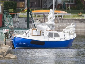 The boat from which a man in his 40's fell into Lac St-Louis is tied up at the Beaconsfield Yacht Club during a search for him, Wednesday July 20, 2016.