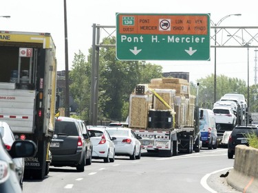 Traffic slows heading to the Mercier Bridge in Montreal Thursday July 21, 2016 as construction forces traffic onto one lane in either direction.
