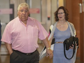 Alain Goyer, left, former colleague of Richard Henry Bain, leaves the courtroom for the trial of Richard Henry Bain, who is charged with the murder Denis Blanchette along with five other charges, at the courthouse in Montreal on Monday, July 25, 2016.