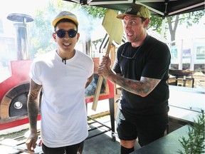 Chefs Chuck Hughes (right) and Danny Smiles at Jean-Drapeau park Wednesday, July 27, 2016 at the site of their pop-up kitchen set-up for artists who will be performing at the Osheaga festival.
