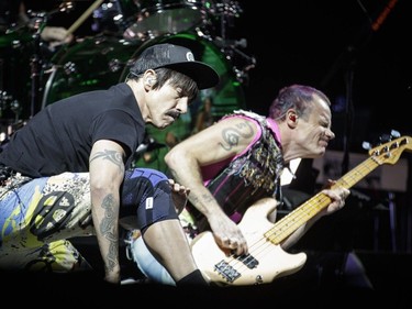 Anthony Kiedis, left, and bassist Flea, right, of the American band Red Hot Chili Peppers perform during Day One of the Osheaga Music and Arts Festival at Parc Jean-Drapeau in Montreal on Friday, July 29, 2016.