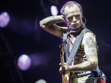 Bassist Flea of the American band Red Hot Chili Peppers performs during Day One of the Osheaga Music and Arts Festival at Parc Jean-Drapeau in Montreal on Friday, July 29, 2016.
