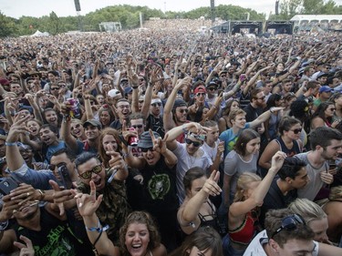 Music fans cheer during the performance by Cypress Hill during Day One of the Osheaga Music and Arts Festival at Parc Jean-Drapeau in Montreal on Friday, July 29, 2016.