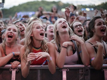 Music fans enjoy the performance by the U.S. folk rock band The Lumineers during Day One of the Osheaga Music Festival at Jean-Drapeau Park in Montreal on Friday, July 29, 2016.