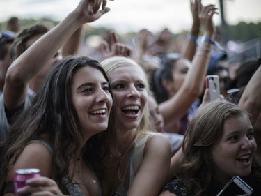 Music fans enjoy the performance by the American folk rock band The Lumineers during Day One of the Osheaga Music and Arts Festival at Parc Jean-Drapeau in Montreal on Friday, July 29, 2016.
