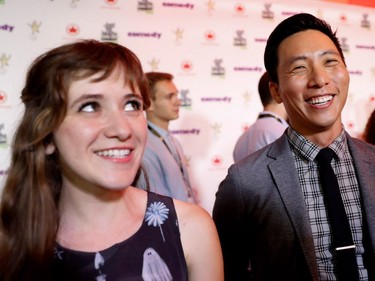 Noel Wells, left, and Kelvin Yu tell a joke during a TV interview on the red carpet at the arrival for the Just For Laughs Awards Show in Montreal on Friday, July 29, 2016. The pair were guests at the awards show.