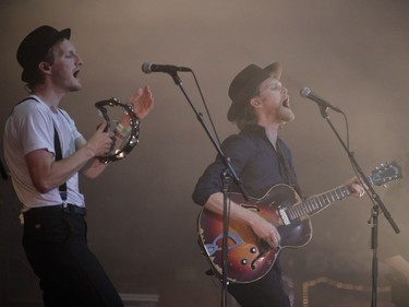 Wesley Schultz, right, of the American folk rock band The Lumineers performs during Day One of the Osheaga Music and Arts Festival at Parc Jean-Drapeau in Montreal on Friday, July 29, 2016.