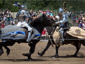A performer known as Sir William, left, drives his joust in to Sir Timothy as The Knights of Valour headline the Festival Saint-Lazare au Galop in Montreal, on Sunday, July 3, 2016. The two performers are a father and son team. The son, Sir William won the 5 round jousting competition by 1 point. (Allen McInnis / MONTREAL GAZETTE)  ORG XMIT: 56505
