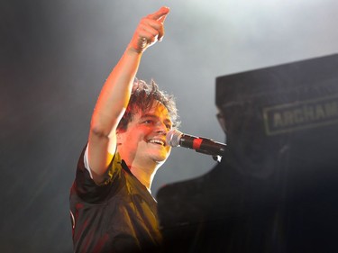 Jamie Cullum performs at the piano, during the second of three big free outdoor blowout concerts at the Montreal International Jazz Festival at the Place des Festivals on July 4, 2016.