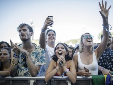 Music fans enjoy the performance by the American rock band The Arcs on Day Two of the Osheaga Music and Arts Festival at Parc Jean-Drapeau in Montreal on Saturday, July 30, 2016.