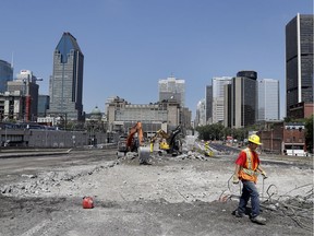 Crews work on the demolition of the Bonaventure Expressway in Montreal on Wednesday July 6, 2016.