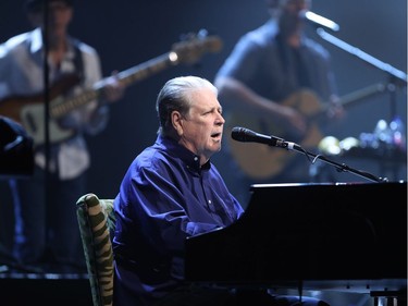 Brian Wilson of Beach Boys fame performs at the piano, middle, at Salle Wilfrid-Pelletier of Place des Arts as part of the Montreal International Jazz Festival on Thursday, July 7, 2016, along with Al Jardine and Blondie Chaplin.