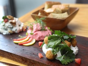 Su restaurant serves (from right) labne with filtered garlic yogourt with herbs salad and tempura olives, tarama with emulsion of fish caviar, and creamy feta cheese with walnuts, parsley and Turkish pepper.