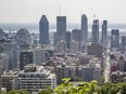 A view of the Montreal city skyline including the St. Lawrence river and Mountain street seen from the Mount-Royal lookout on Monday, June 20, 2016.