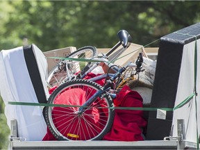 A truck loaded with furniture is shown in Montreal, Friday, July 1, 2016, on what's now known as Moving Day in Quebec.