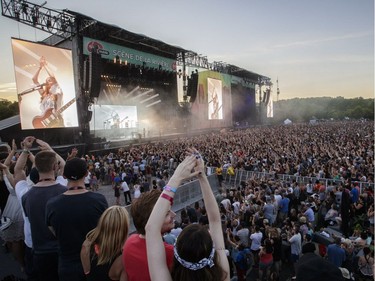 Music fans enjoy the performance by American rock band Haim on Day Two of the Osheaga Music and Arts Festival at Parc Jean-Drapeau in Montreal on Saturday, July 30, 2016.