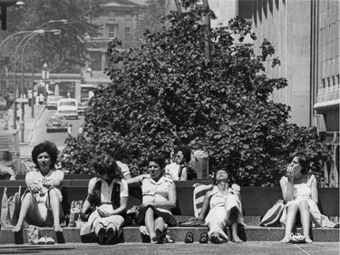 August 1976: The lunchtime crowd take in the sun outside Place Ville Marie.